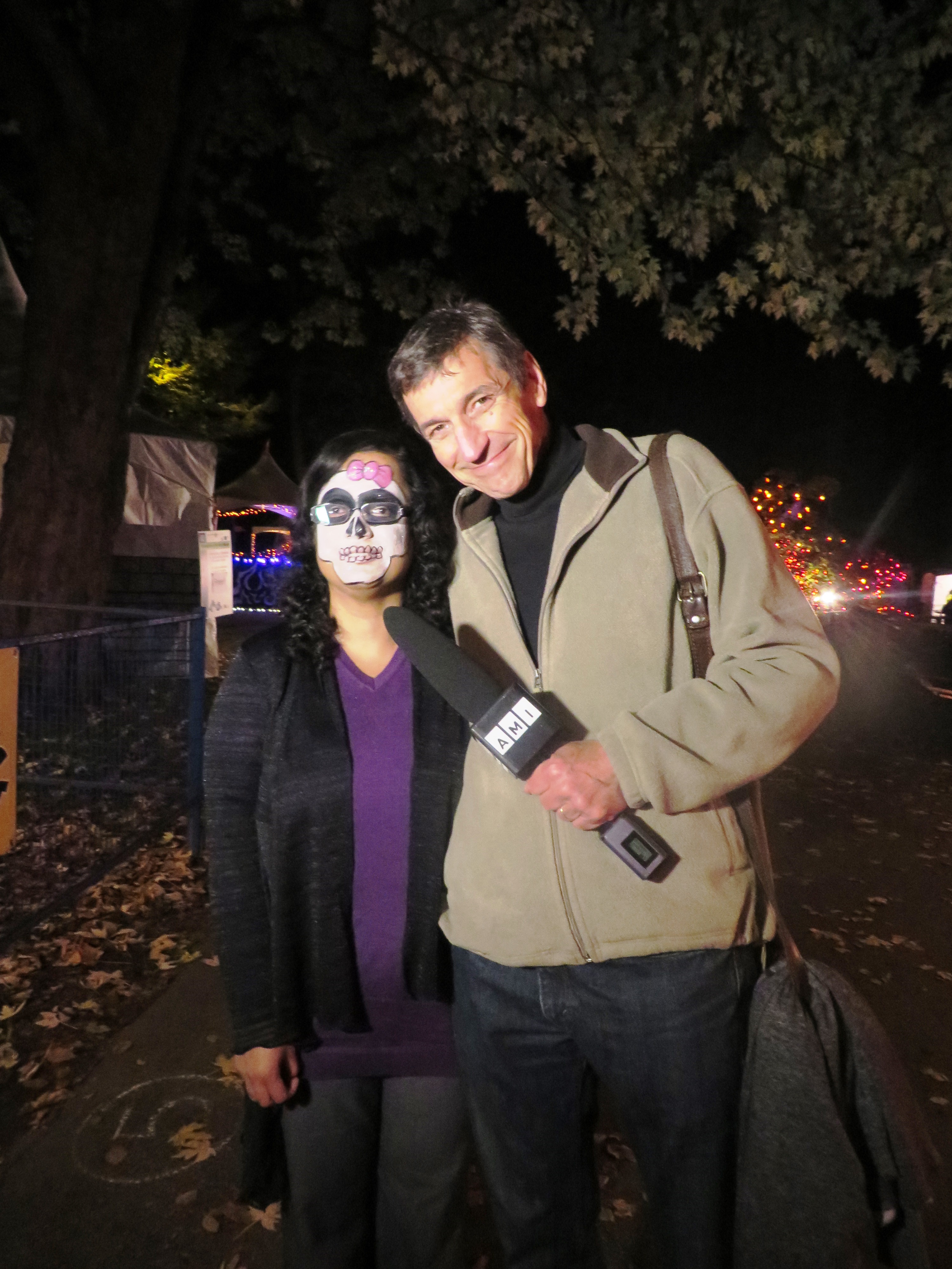 Kristy, her face painted with a Hello Kitty skull, stands with Peter Hall